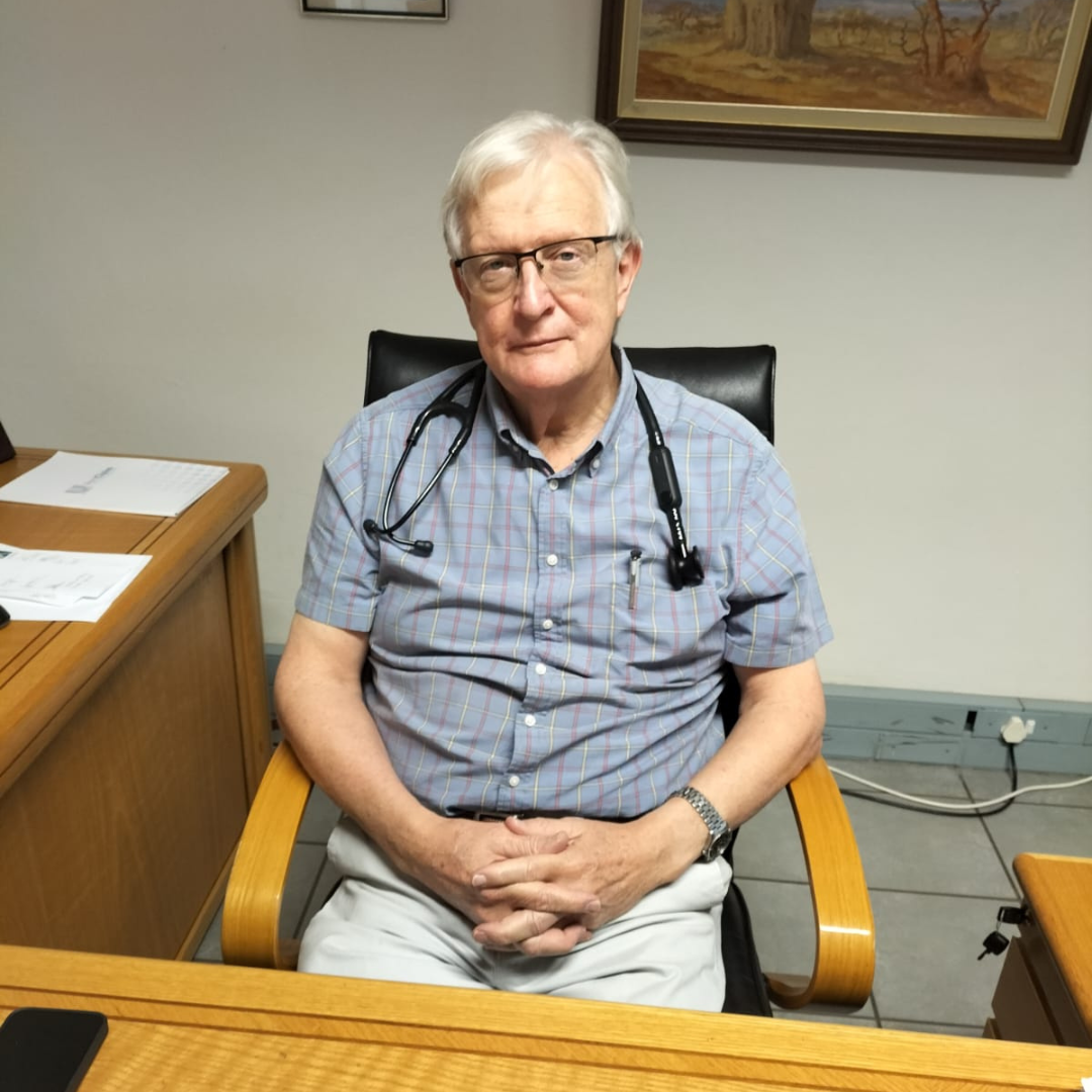 close up of doctor behind desk